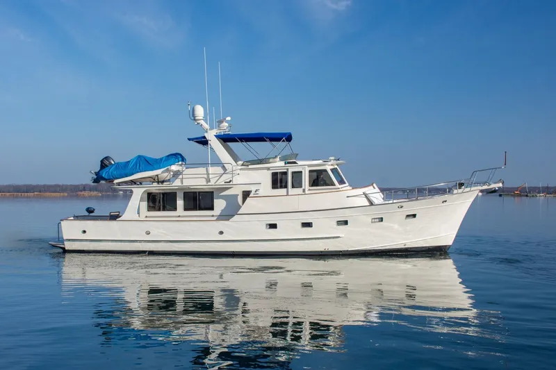 The Image of 2000 Fleming 55 yacht on calm water under clear blue sky. - 0
