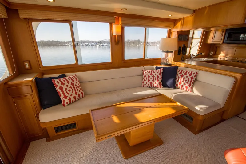 Slide: The Image of Luxurious interior of a 2000 Fleming 55 yacht with elegant seating and scenic window views. - 3