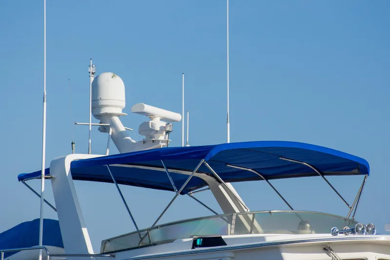 Slide: The Image of Top view of a 2000 Fleming 55 yacht with blue canopy and radar equipment. - 32