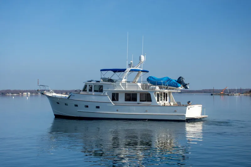 Slide: The Image of Fleming 55 yacht from 2000 on calm water under clear blue sky. - 50