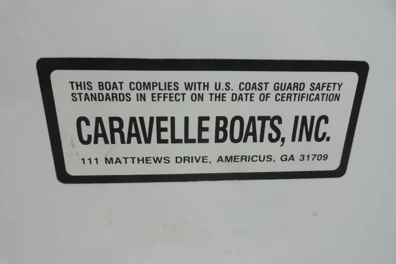 Slide: The Image of Sticker on Caravelle Interceptor 232, 1997, showing U.S. Coast Guard compliance. - 11