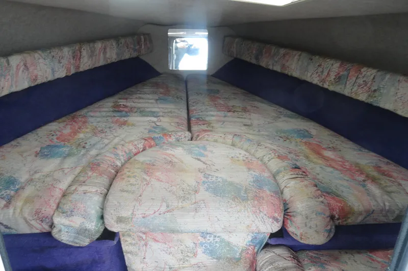 Slide: The Image of Interior cabin of 1997 Caravelle Interceptor 232 with colorful patterned cushions. - 16