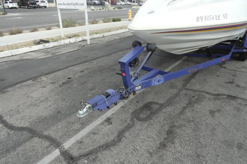 Slide: The Image of Trailer hitch of a 1997 Caravelle Interceptor 232 boat in a parking lot. - 20