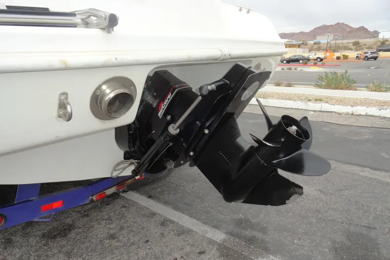 Slide: The Image of 1997 Caravelle Interceptor 232 boat with MerCruiser outdrive in parking lot. - 21