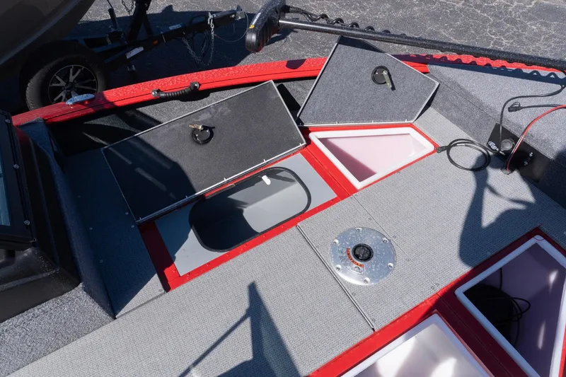 Slide: The Image of 2026 G3 Angler V21 F boat interior with open storage compartments and fishing equipment. - 7