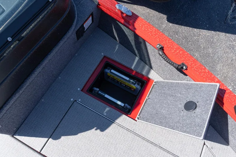 Slide: The Image of 2026 G3 Angler V21 F boat storage compartment with open hatch and visible battery. - 8