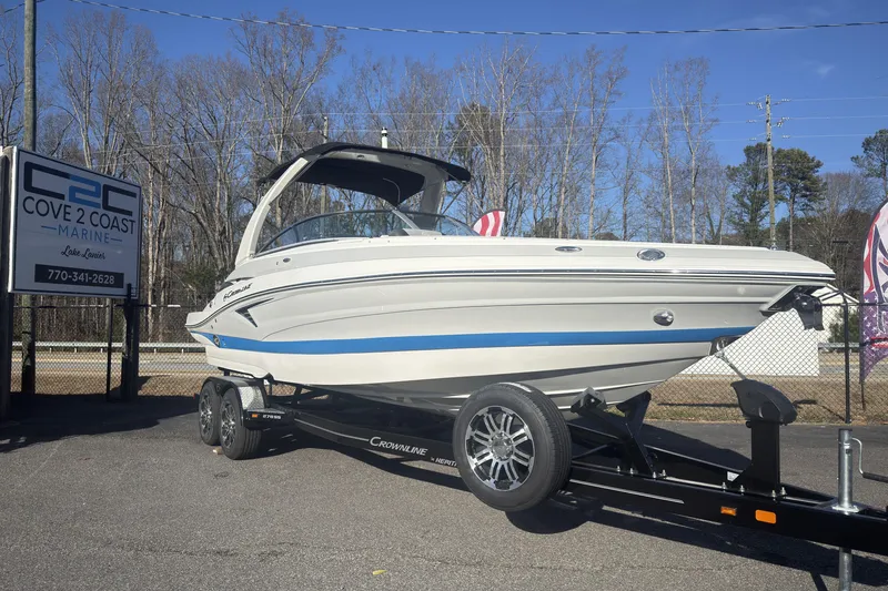 Slide: The Image of 2026 Crownline 278 SS boat on trailer at Cove 2 Coast Marine dealership. - 2