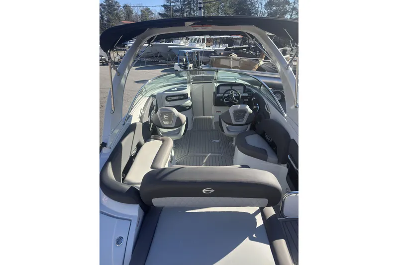 Slide: The Image of 2026 Crownline 278 SS boat interior with modern seating and steering wheel. - 3