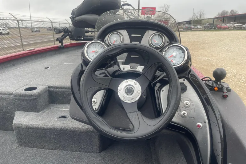 Slide: The Image of 2021 Tracker Pro Team 175 TXW boat dashboard with steering wheel and gauges. - 5