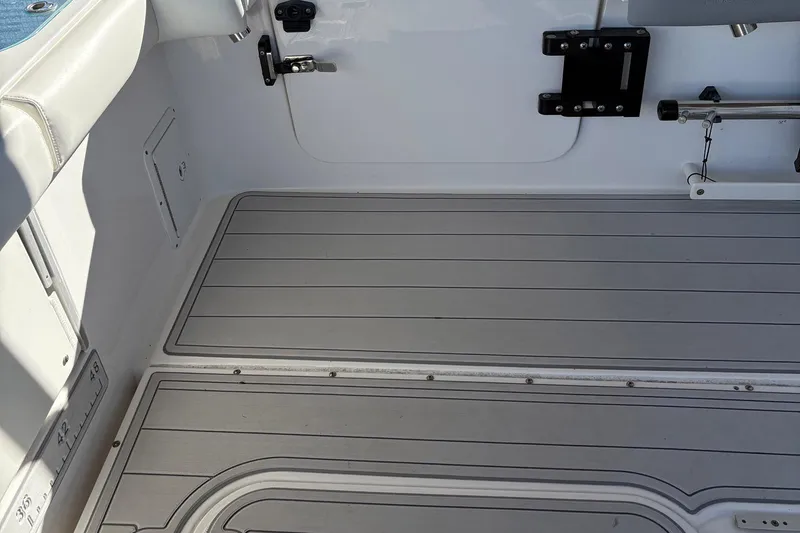 Slide: The Image of Interior view of 2017 Everglades 350LX boat, featuring clean deck and seating area. - 10