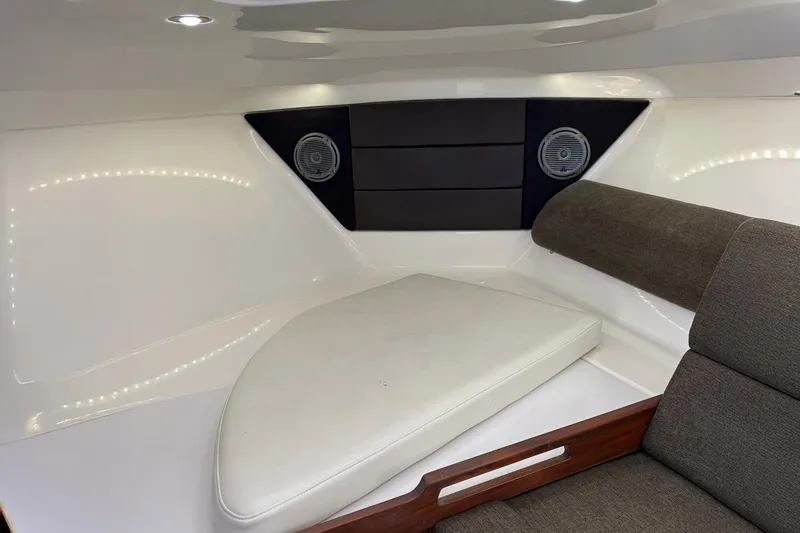 Slide: The Image of Interior cabin of 2017 Everglades 350LX boat with cushioned seating and speakers. - 4