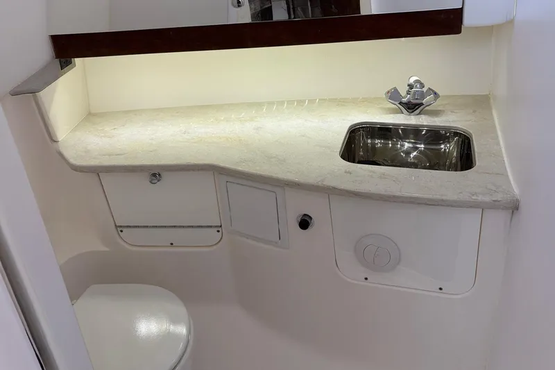 Slide: The Image of 2017 Everglades 350LX boat interior with sink and countertop. - 5