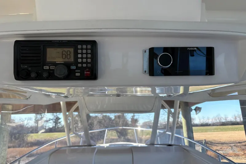 Slide: The Image of 2017 Everglades 350LX boat dashboard with radio and control panel. - 8