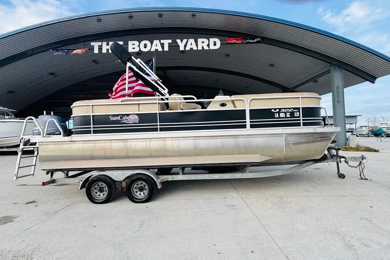 Slide: The Image of 2014 SunCatcher V322 RC pontoon boat on trailer at The Boat Yard. - 1