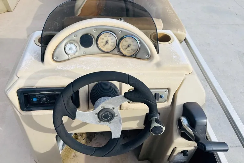 Slide: The Image of Steering console of a 2014 SunCatcher V322 RC boat with gauges and controls. - 11