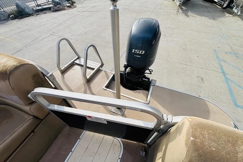 Slide: The Image of 2014 SunCatcher V322 RC boat with Yamaha 150 outboard motor and seating area. - 13