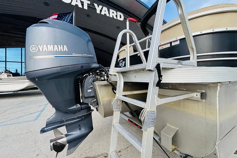 Slide: The Image of 2014 SunCatcher V322 RC pontoon boat with Yamaha outboard motor at boat yard. - 3