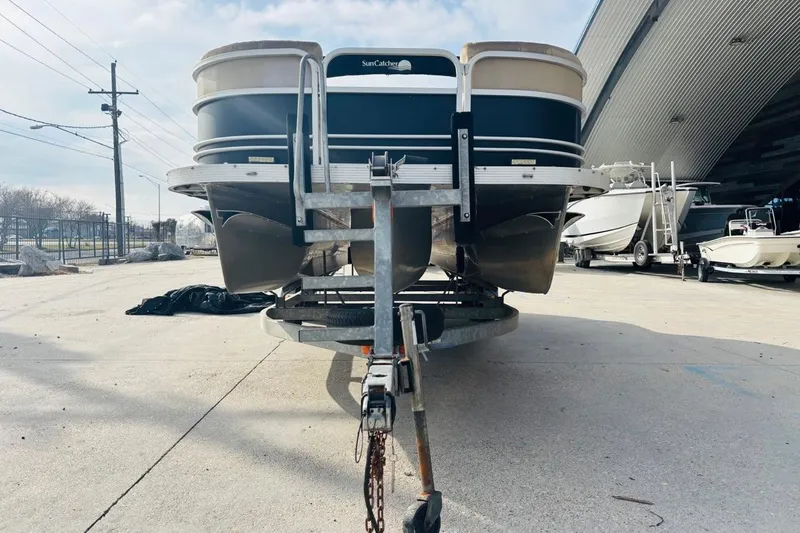 Slide: The Image of 2014 SunCatcher V322 RC pontoon boat on trailer, parked outdoors. - 9