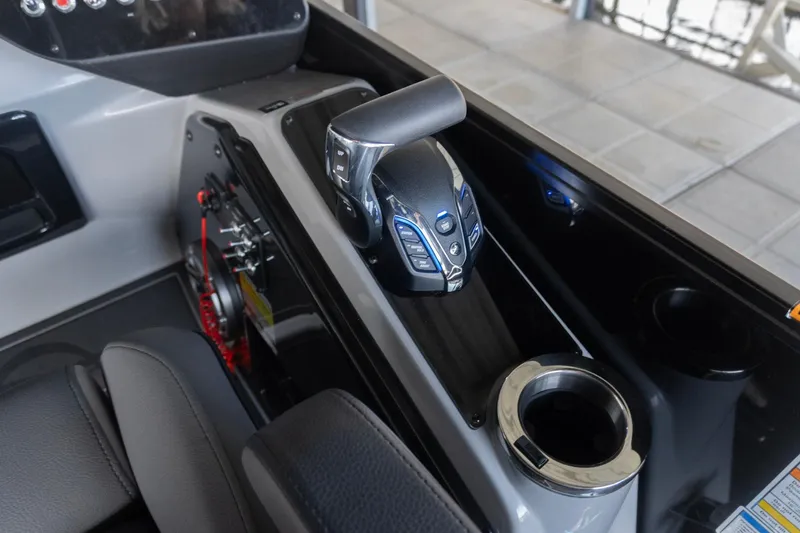 Slide: The Image of Control panel of 2026 SunCatcher Diamond Elite 326 SL boat with cup holder. - 13