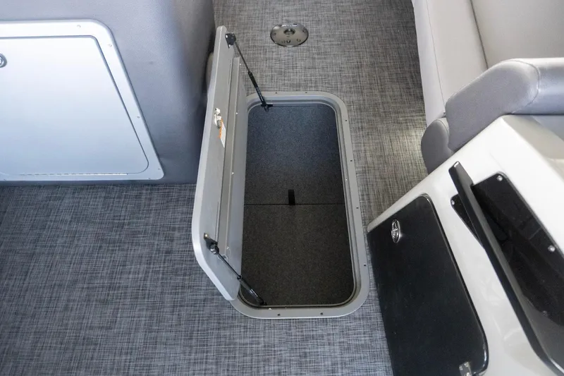 Slide: The Image of Open storage compartment on 2026 SunCatcher Diamond Elite 326 SL boat interior. - 18