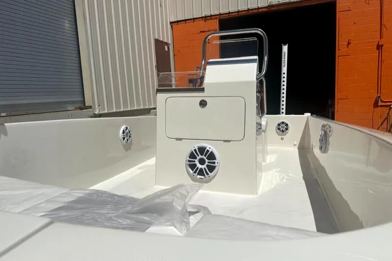 Slide: The Image of 2024 BlueCat 17 boat interior with console and speakers. - 6