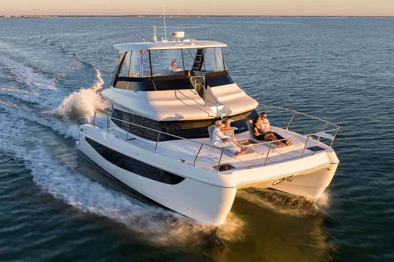 The Image of Manufacturer Provided Image: 2026 Aquila 42 Yacht cruising on open water at sunset. - 0