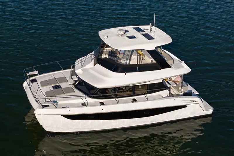 Slide: The Image of Manufacturer Provided Image: 2026 Aquila 42 Yacht on calm water, showcasing sleek design and modern features. - 1