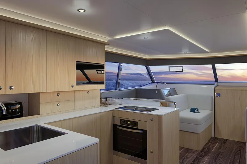 Slide: The Image of Manufacturer Provided Image: Luxurious interior of 2026 Aquila 42 Yacht with modern kitchen and ocean view. - 11