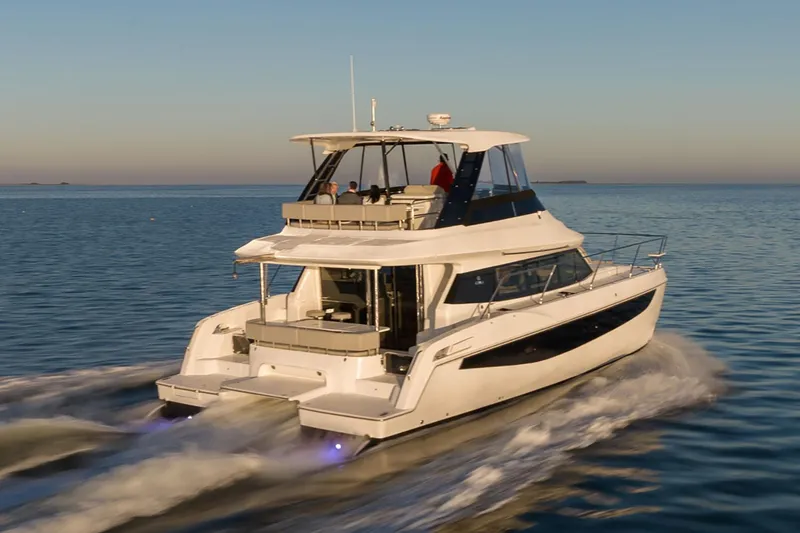 Slide: The Image of Manufacturer Provided Image: 2026 Aquila 42 Yacht cruising on calm waters at sunset. - 3