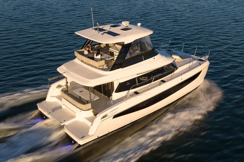 Slide: The Image of Manufacturer Provided Image: 2026 Aquila 42 Yacht cruising on open water at sunset. - 4