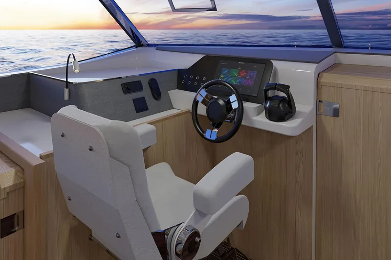 Slide: The Image of Manufacturer Provided Image: 2026 Aquila 42 Yacht helm with modern controls, steering wheel, and ocean view. - 9