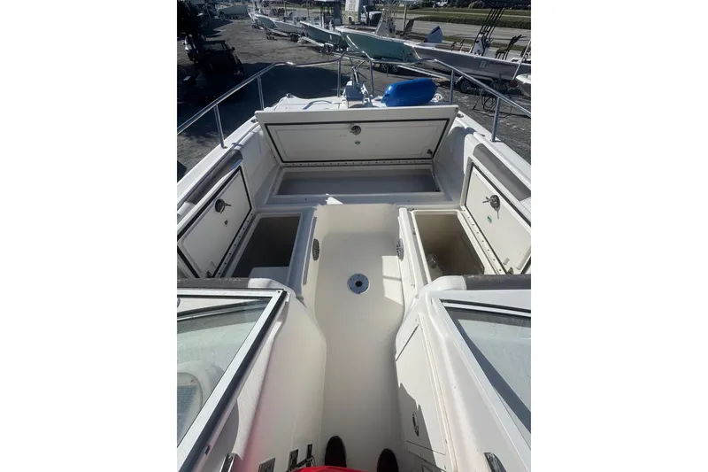 Slide: The Image of 2017 World Cat 255 DC boat interior with open storage compartments. - 5