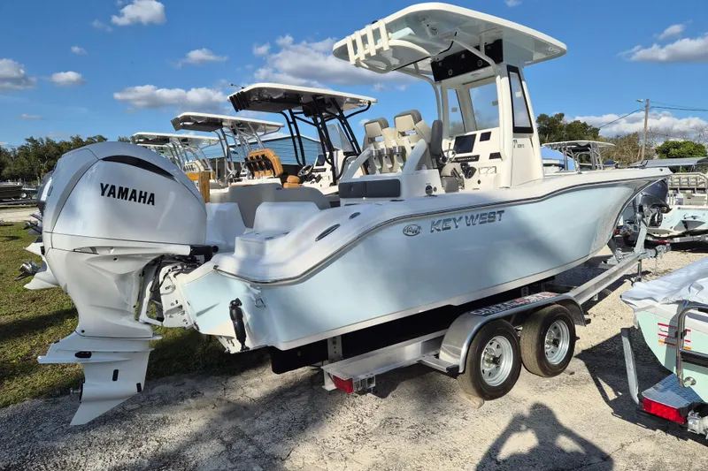 The Image of 2026 Key West 239 FS boat with Yamaha engine on trailer under blue sky. - 0