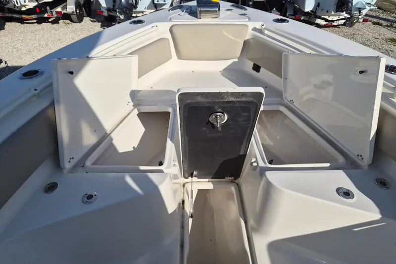 Slide: The Image of 2026 Key West 239 FS boat interior with open storage compartments. - 12