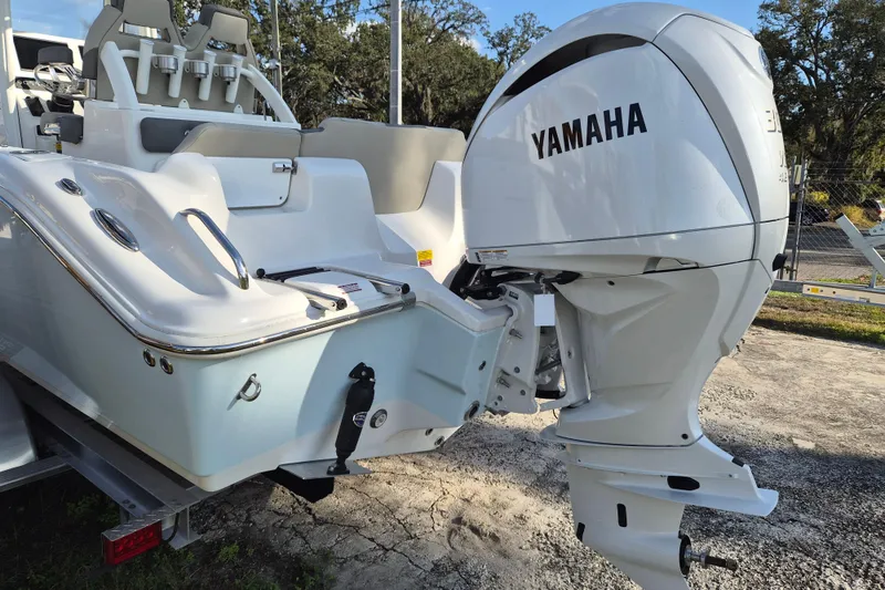 Slide: The Image of 2026 Key West 239 FS boat with Yamaha outboard motor, rear view. - 2