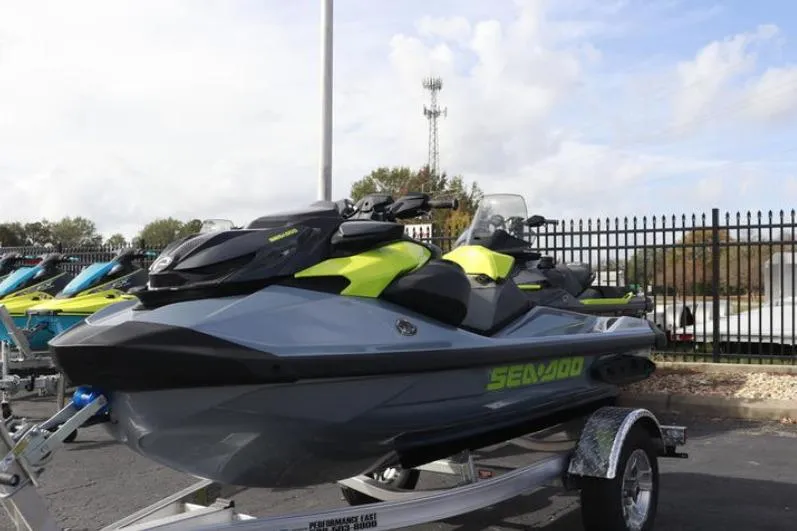 Slide: The Image of 2024 Sea-Doo RXP-X 325 jet ski on trailer, parked outdoors. - 12