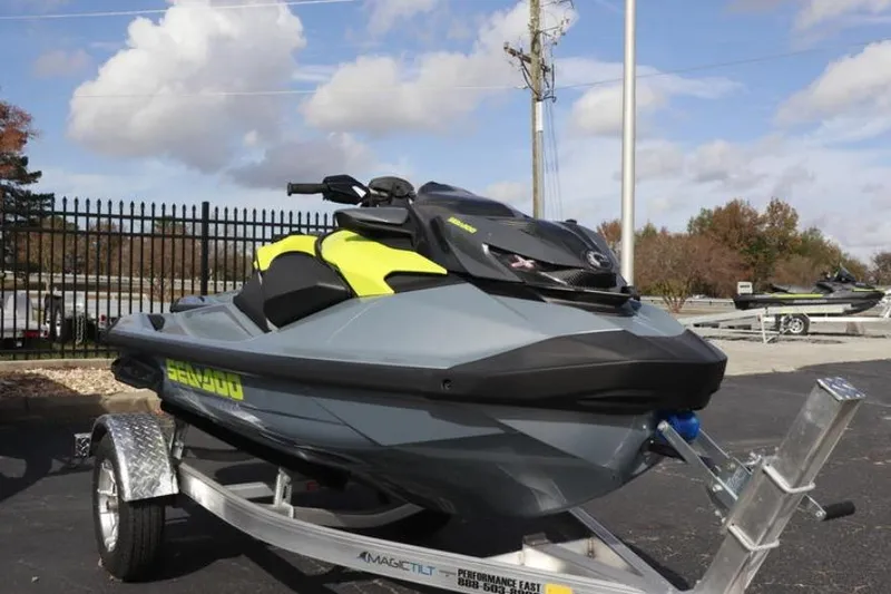 The Image of 2024 Sea-Doo RXP-X 325 jet ski on trailer, parked outdoors. - 5