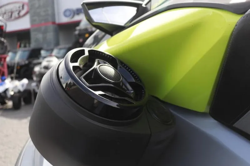 Slide: The Image of 2024 Sea-Doo RXP-X 325 jet ski with vibrant green detailing and speaker system. - 9