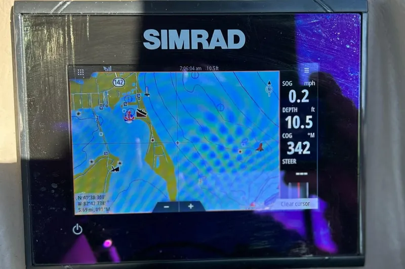 Slide: The Image of Simrad navigation display on 2018 Bennington 25 QCW, showing map and boat data. - 17