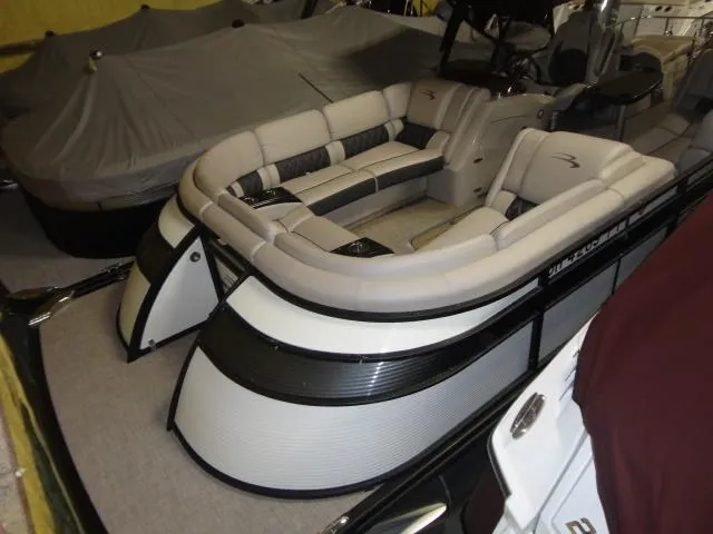 Slide: The Image of 2018 Bennington 25 QCW pontoon boat with luxurious seating arrangement. - 18