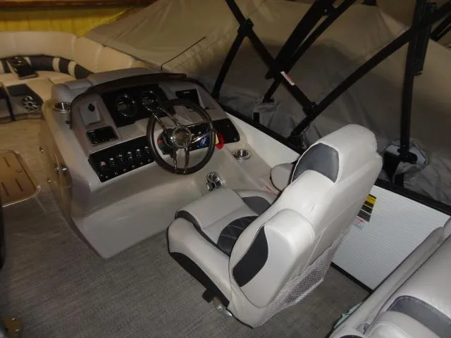 Slide: The Image of Interior of a 2018 Bennington 25 QCW boat with helm console. - 28