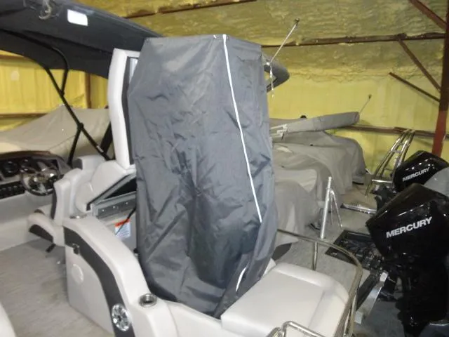 Slide: The Image of 2018 Bennington 25 QCW boat with cover and Mercury engines. - 33