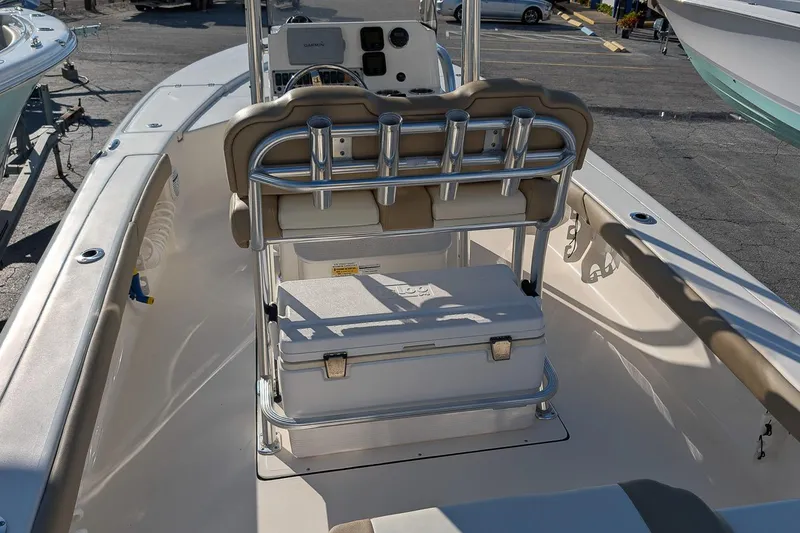 Slide: The Image of 2014 Key West 246 Bay Reef boat interior with seating and storage. - 12