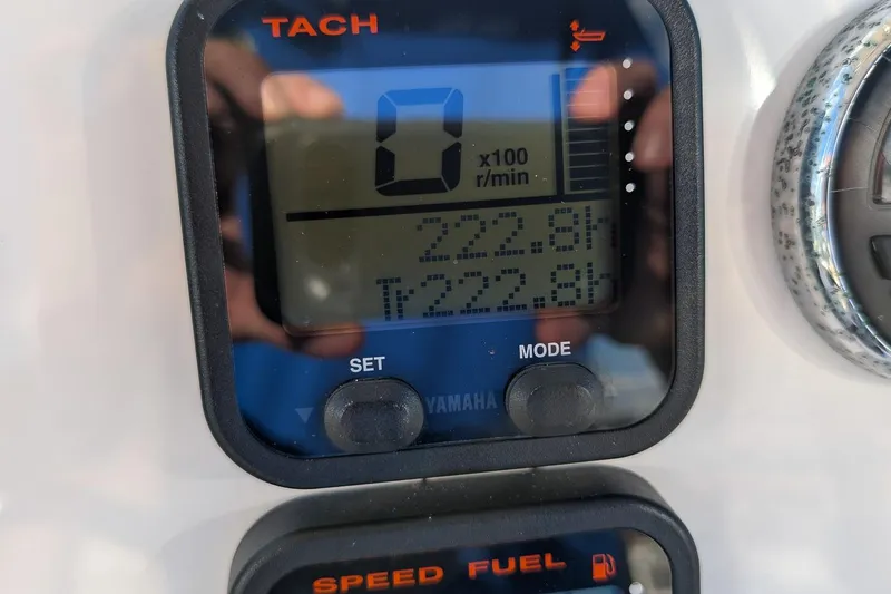 Slide: The Image of Close-up of Yamaha tachometer on 2014 Key West 246 Bay Reef boat dashboard. - 16