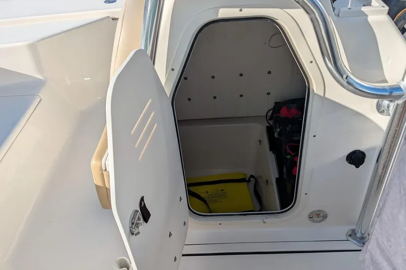 Slide: The Image of Open storage compartment on a 2014 Key West 246 Bay Reef boat. - 19