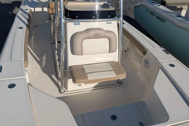 Slide: The Image of 2014 Key West 246 Bay Reef boat interior with seating and console. - 20