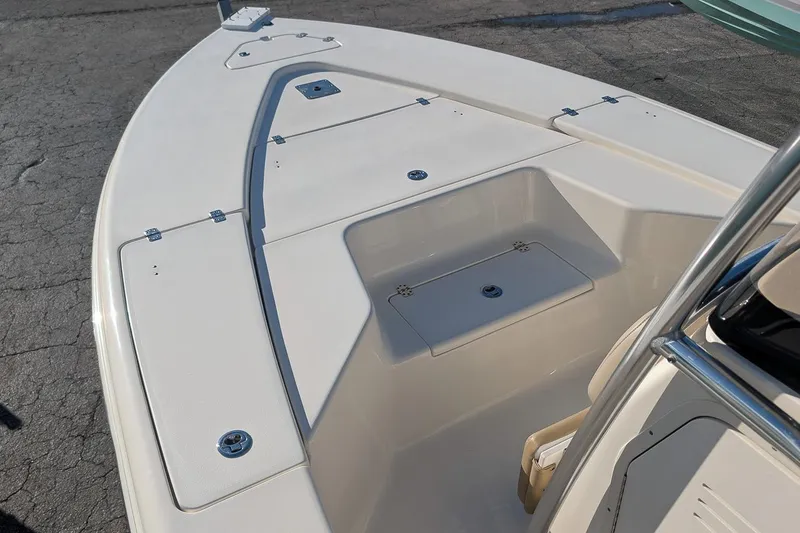 Slide: The Image of 2014 Key West 246 Bay Reef boat deck with storage compartments. - 21