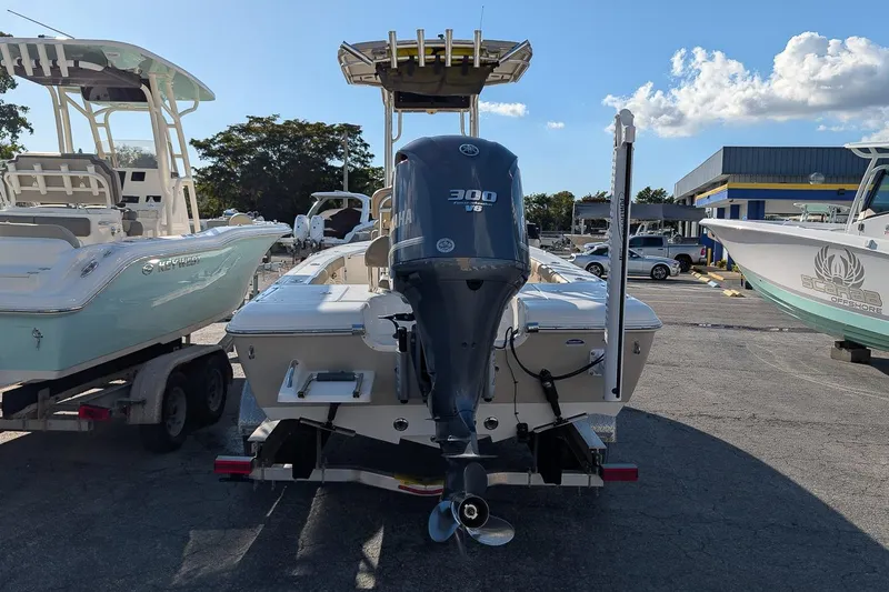 Slide: The Image of 2014 Key West 246 Bay Reef boat with Yamaha 300 V6 engine, parked in a marina. - 4