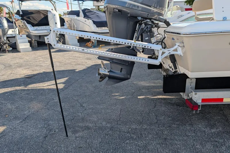 Slide: The Image of 2014 Key West 246 Bay Reef boat with motor and anchor pole on display. - 5