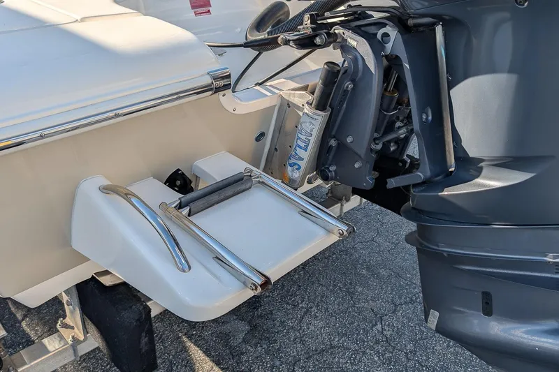 Slide: The Image of 2014 Key West 246 Bay Reef boat with outboard motor and swim platform. - 7